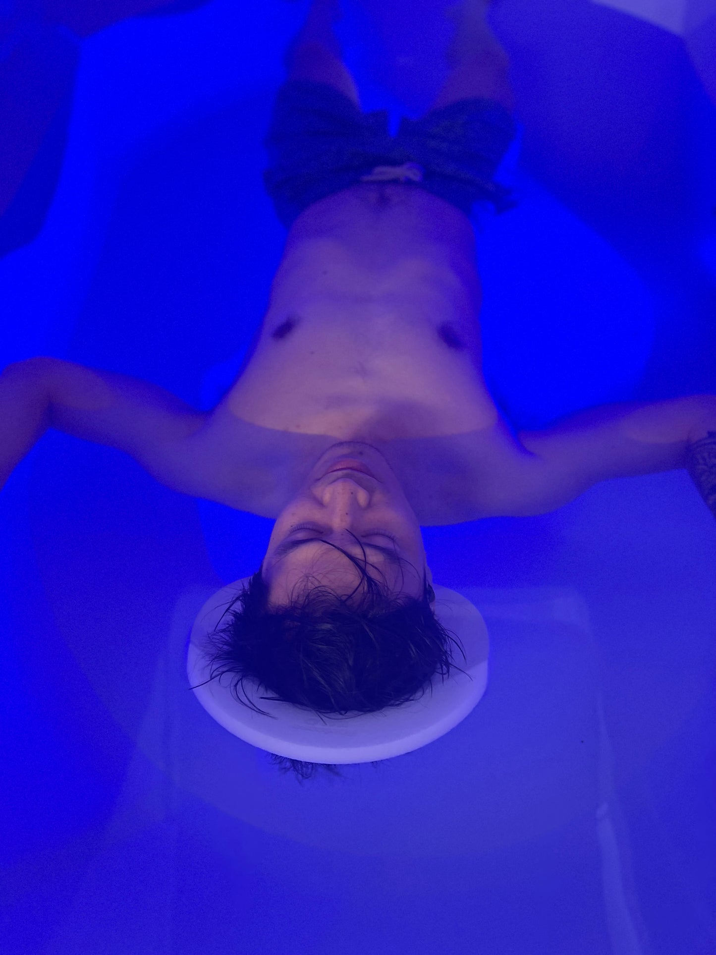 Soothing blue LED interior lighting inside a premium Dreampod Home Float Plus tank.
