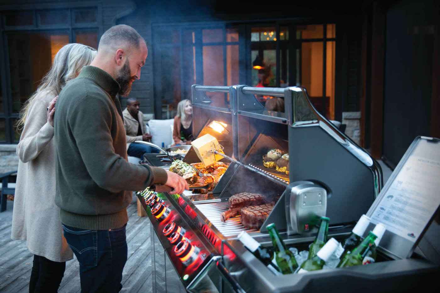 large capacity gas grill cooking multiple dishes simultaneously