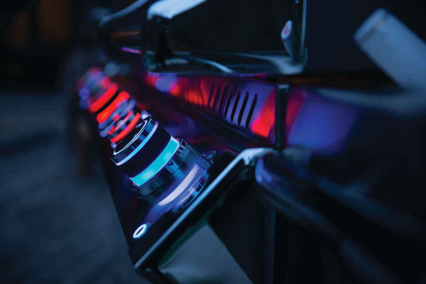  built-in luxury grill with LED control knobs illuminated at night
